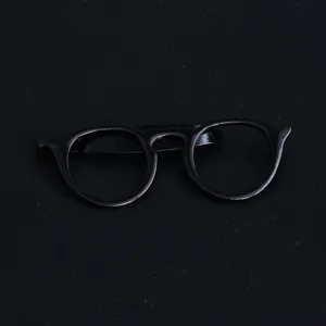 Detailed close-up view of a unique black glasses shaped metal tie clip for men formal wear.