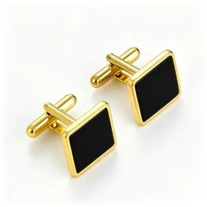 Detail view of men's gold square cufflinks with black enamel inlay, elegant French shirt accessory.