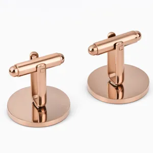Glossy rose gold round stainless steel French cufflinks detail, elegant men's shirt accessory.