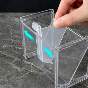 Caja de almacenamiento de cosméticos de acrílico transparente con divisores ajustables.