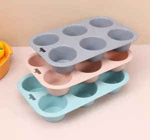 Silicone muffin mold detail shot, showing 6-cup stackable baking pans in vibrant colors.