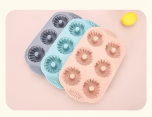 Silicone baking mold detail view showing textured cavities and pastel color options in studio.