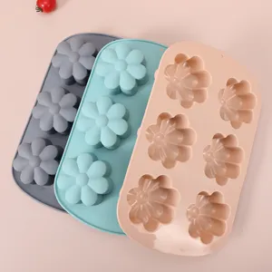 Close-up detail of 3-piece multi-color flower silicone baking molds for cakes and muffins.