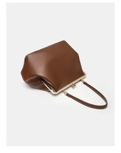 Brown leather kiss-lock frame handbag detail, elegant metal hardware, chic evening clutch bag.