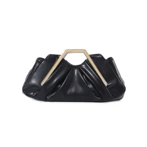 Black pleated clutch bag detail featuring a unique geometric gold metal handle for evening wear.