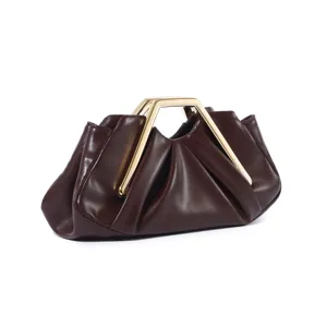 Detailed close-up of dark brown ruched clutch bag featuring a sleek geometric metal handle.