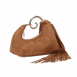 Brown suede handbag with unique metal swirl handle and elegant fringe tassel detail.