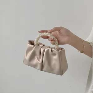 Sweet pearl handle ruched handbag for women, versatile pleated cloud crossbody mini bag style.