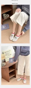 Detailed view of cute cotton women low cut socks with puppy embroidery and stripes.