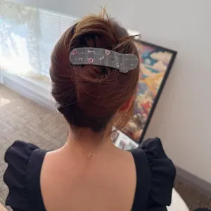Korean style grey plaid hair clip detail shot, elegant back head hair styling accessory.