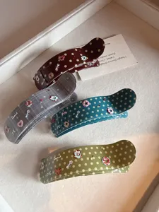 Korean acetate polka dot large hair claw clip detail shot, elegant retro hair accessory.