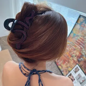 Detailed view of the stylish rhinestone hair claw clip, perfect for elegant back head updos.