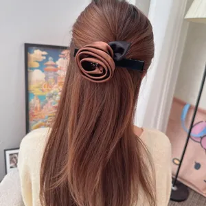Vintage brown fabric rose hair clip with elegant bow and rhinestone details for women.