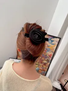 Vintage fabric rose rhinestone hair clip for women, elegant black hair barrette accessory.