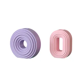 Detailed view of modern minimalist geometric ring and oval silicone mold with concentric groove design.