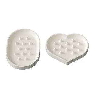 Heart shaped and oval jewelry tray silicone molds, perfect for DIY plaster casting crafts.