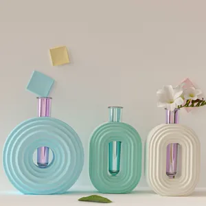 Modern minimalist pastel ceramic vases set with glass test tube inserts for desktop decor.