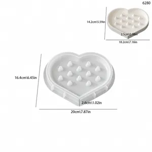 Heart-shaped silicone ring storage tray mold with inner cone pins for jewelry making display.