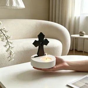 Detail view of Nordic style cross candle holder silicone mold and gypsum base decor item.