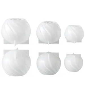Detailed view of spherical spiral silicone mold for DIY candles and resin crafts.