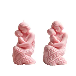 Prachtig detail van roze moeder en kind sculptuur kaars, warme huisdecoratie ornament.