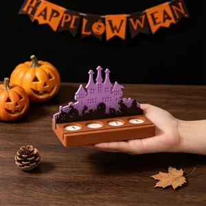 Moule en silicone pour bougeoir château d'Halloween avec motifs de citrouilles et fantômes.