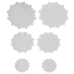 Detail view of flower shaped silicone molds in multiple sizes with hanging holes for crafts.