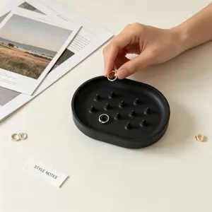 Silicone ring holder tray detail, black aesthetic jewelry organizer with pegs for decor.