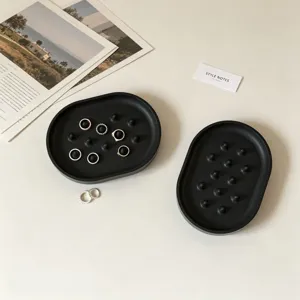 Black oval silicone ring storage tray desktop jewelry display plate with holders.