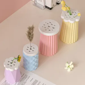 Creative flower arrangement vase silicone mold with perforated lid and stylish striped design.