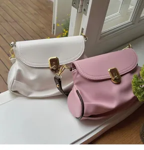 Women's soft leather underarm shoulder bag with chic folding design, elegant daily purse.