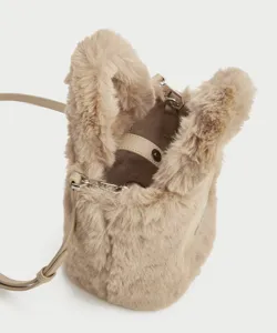 Fluffy plush bucket bag detail showing soft faux fur texture, metal hardware and shoulder strap.