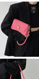 Stylish pink shoulder bag for women, trendy solid color baguette bag with metal buckle.