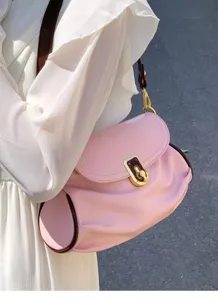 Pink leather shoulder bag detail with contrast brown trim and elegant gold hardware clasp