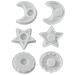 Silicone candle holder mold detail, showing moon star and floral textured tray designs.