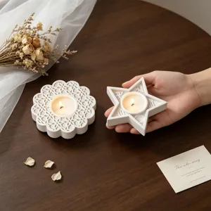 White geometric flower and star candle holders for home decor, detailed texture display.
