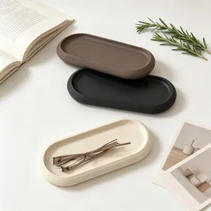 Oval striped silicone tray mold details showing three colors brown black beige with props setup