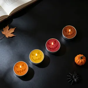 Halloween decorative scented tealight candles with spooky pumpkin ghost face designs for party.