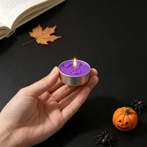 Halloween purple skull tealight candle with spooky design for holiday party decor and gifts.