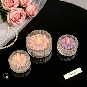 Scented candle set with flower design in ribbed glass jars, elegant home decor table display