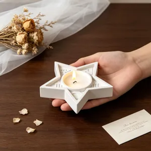 White star shaped candle holder tray with tea light candle for home decor aromatherapy.