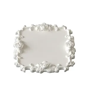 Close-up detail shot of vintage rose lace decorative tray mold, exquisite relief texture.