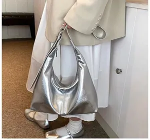 Close-up view of the trendy metallic silver soft leather hobo shoulder bag in a stylish daily look.