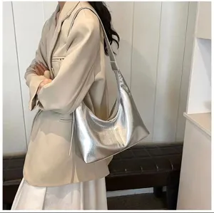 Detail view of the trendy silver metallic soft leather hobo underarm shoulder bag.