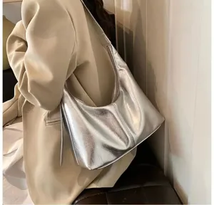Silver soft leather underarm bag detail showcasing texture and minimalist fashion style.