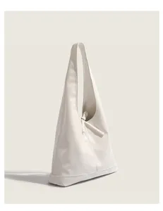 Minimalist white shoulder bag, chic triangular tote design for daily commute and casual use.