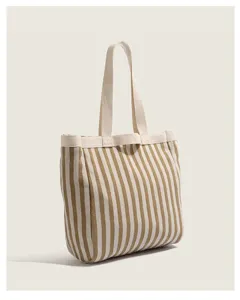 Casual striped canvas tote bag for women, large capacity single shoulder bag for daily use.