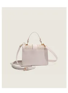 Chic woven handbag detail, straw and leather contrast, compact design for summer style.