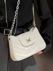 White shoulder bag for women with silver chain strap and cute butterfly charm detail.