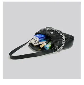 Black fashion shoulder bag with wave texture, metal chain strap, stylish underarm design.
